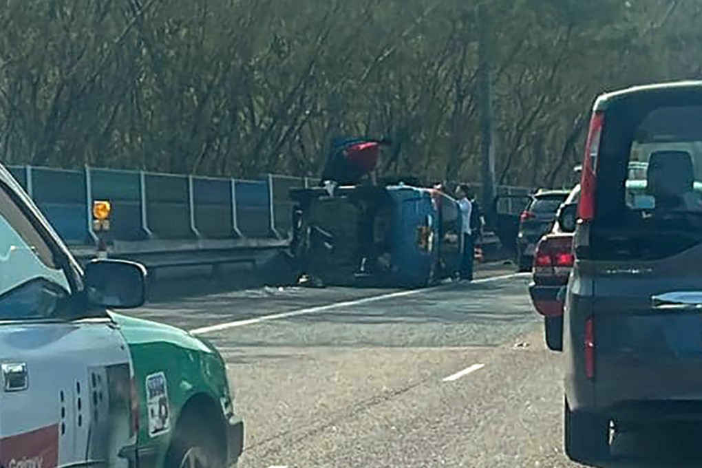 A car sits on its side after a collision with another vehicle on Tolo Highway. Photo: Facebook/Bosco Chu