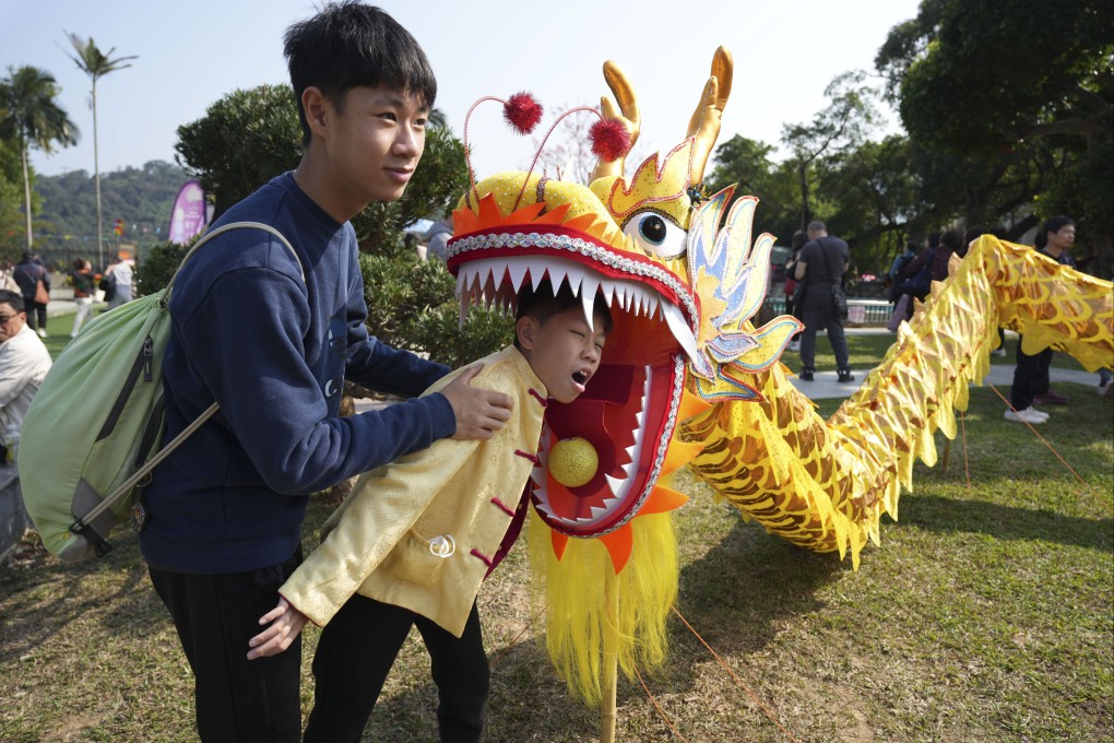 Youngsters pose for photos at the Well-wishing Festival in Lam Tsuen, Tai Po. Photo: Eugene Lee