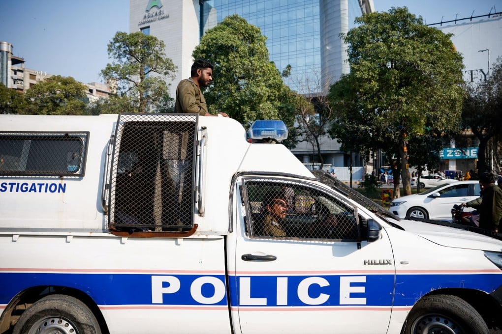 Police officers in Lahore, Pakistan, patrol on Sunday, amid allegations of vote rigging in Thursday’s election. Photo: Reuters