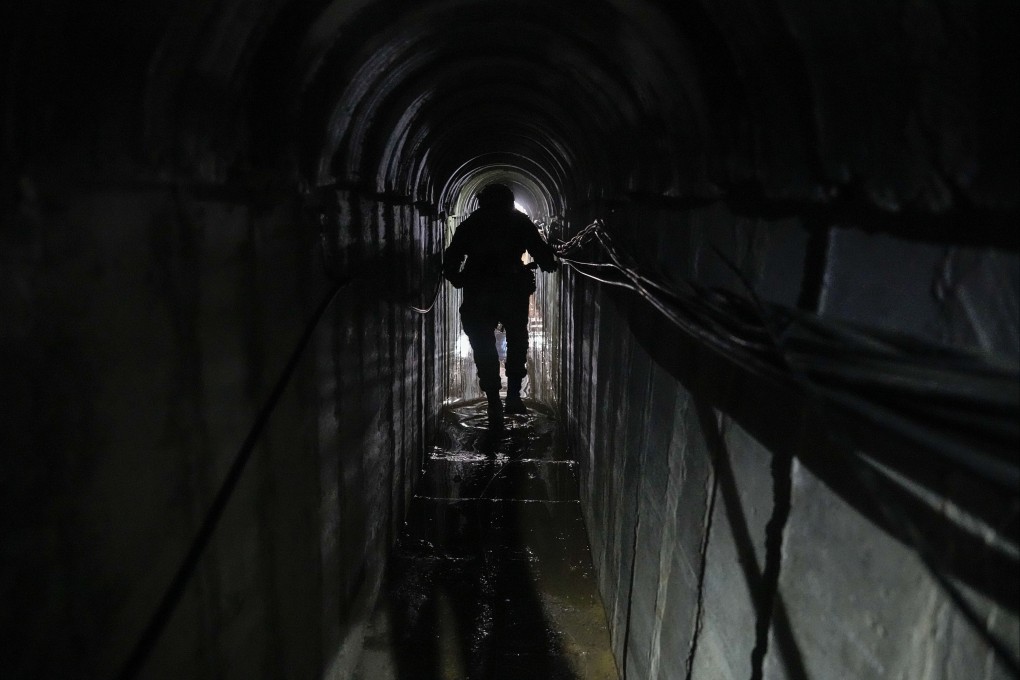 Lieutenant Colonel Ido, whose last name was redacted by the Israeli military, walks inside a tunnel underneath the UNRWA compound in Gaza on Thursday. Photo: AP