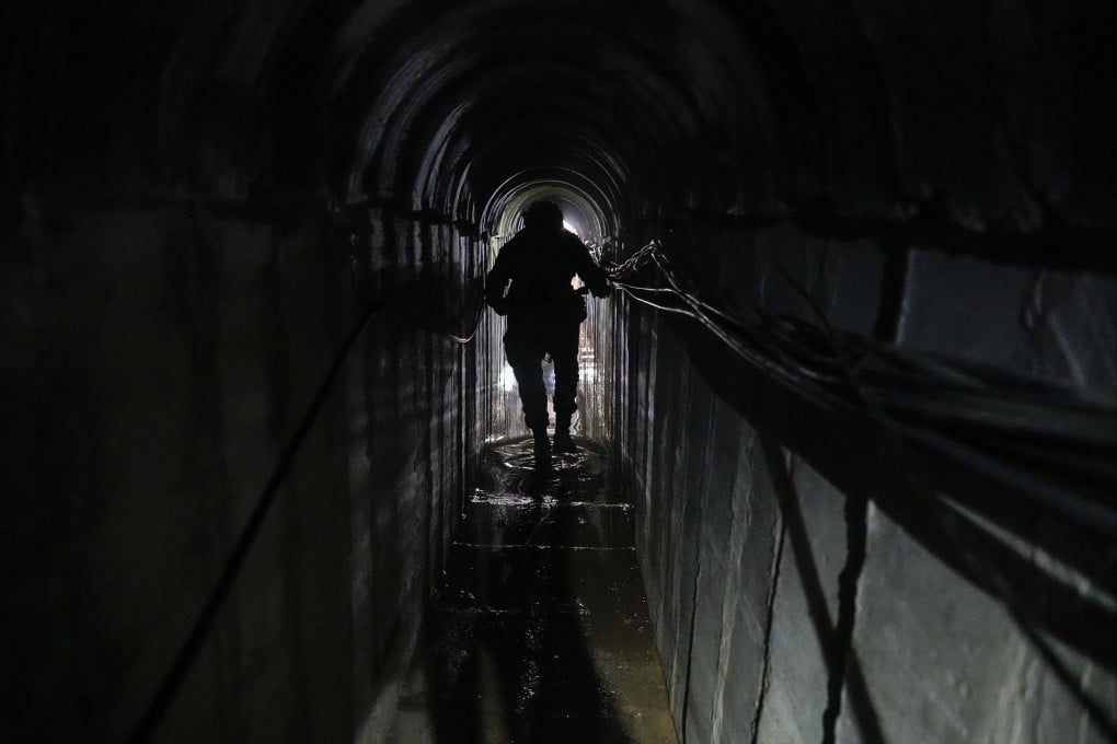 Lieutenant Colonel Ido, whose last name was redacted by the Israeli military, walks inside a tunnel underneath the UNRWA compound in Gaza on Thursday. Photo: AP