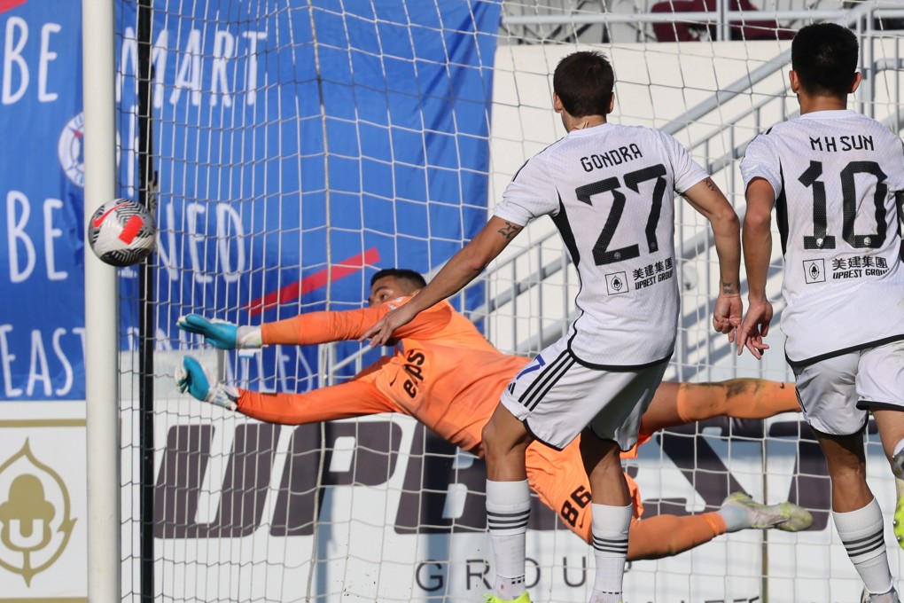 Kitchee goalkeeper Paulo Cesar dives to try and stop a shot from Eastern’s Marcos Gondra during the Senior Shield final at Mong Kok Stadium. Photo: Dickson Lee