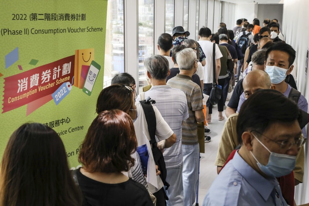 People queue up for the consumption voucher scheme at in Mong Kok. The vouchers had benefited various industries and played a role in boosting the economy during the pandemic, the Federation of Public Housing Estates said. Photo: Yik Yeung-man