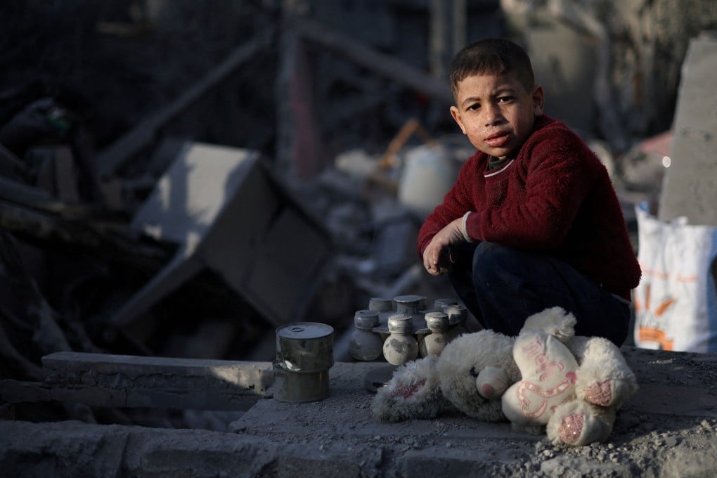A Palestinian child at the site of an Israeli strike on a house in Rafah, in the southern Gaza Strip. Photo: Reuters
