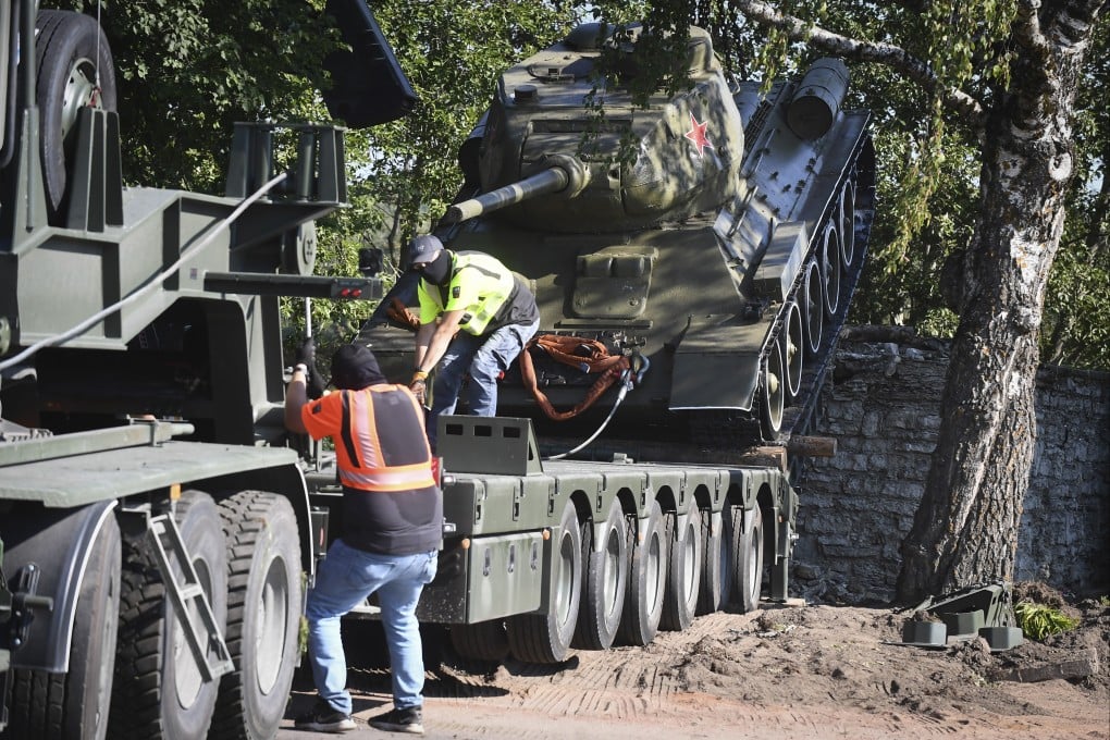 Workers remove a Soviet tank installed as a monument in Narva, Estonia. Estonia’s prime minister Kaja Kallas has been put on a wanted list in Russia because of her efforts to remove Soviet-era World War II monuments in the Baltic nation. Photo: AP