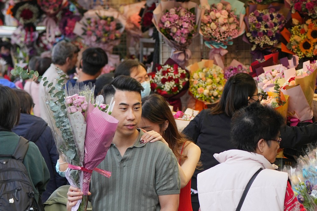 People shop for flowers ahead of Valentine’s Day in Flower Market, Mong Kok. Florists say residents have been tightening their belts. Photo: Eugene Lee