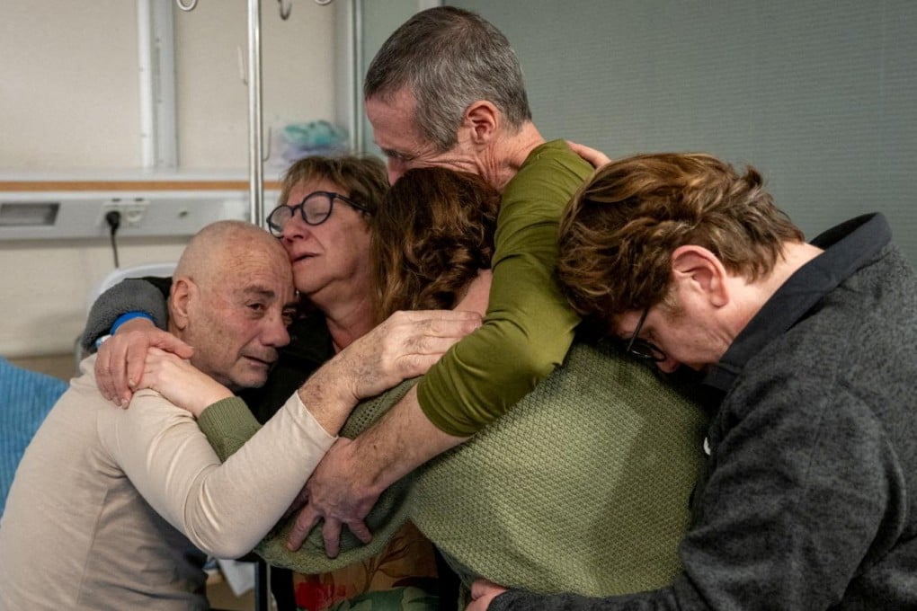 Fernando Simon Marman and Luis Har reunite with loved ones in Israel. Photo: Israel Defence Forces via Reuters
