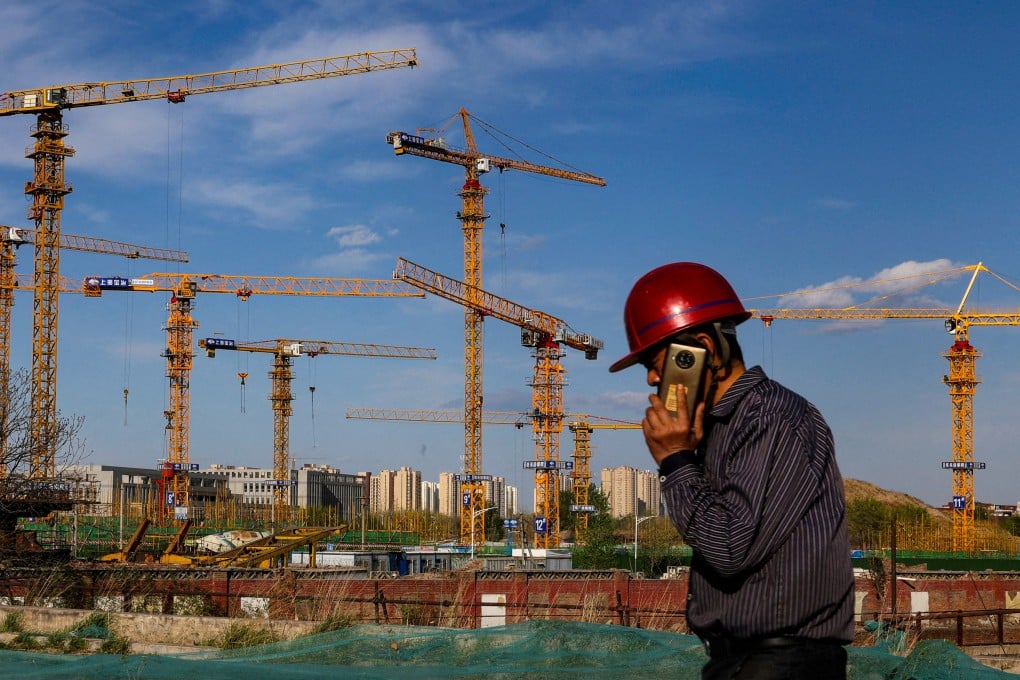 A construction site in Beijing. As of the end of January, the local governments of 170 cities had put forward 3,218 real estate projects for consideration under the whitelist mechanism, according to official figures. Photo: Reuters