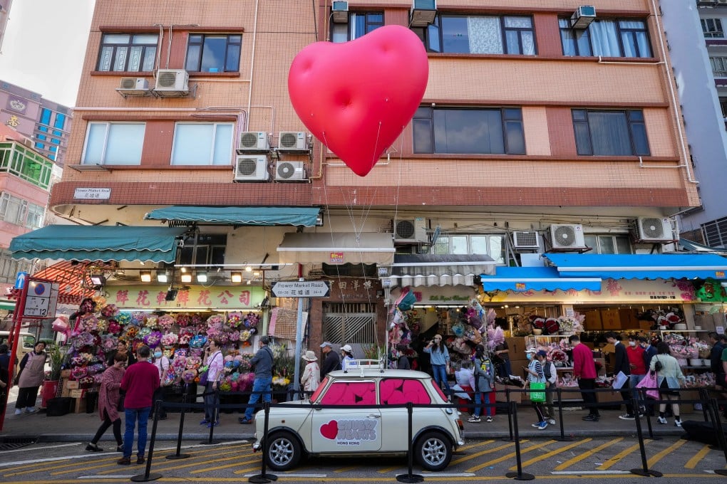 A pop-up Chubby Heart floats in the air at the flower market of Mong Kok. Photo: Elson Li