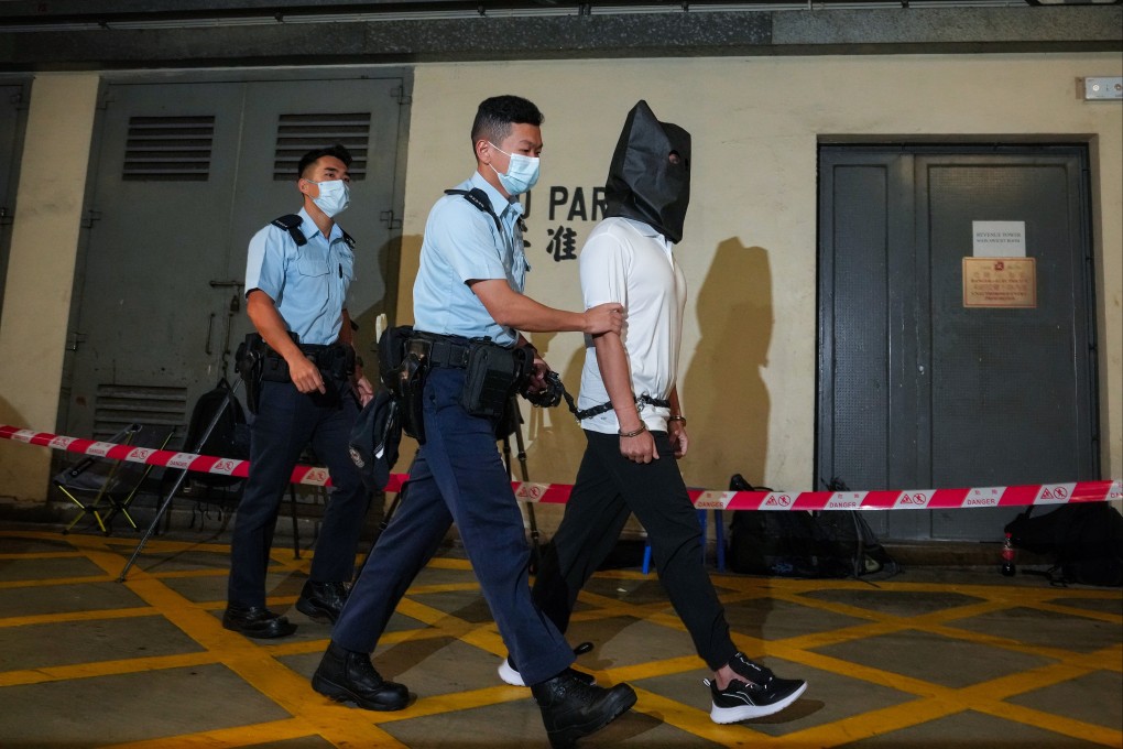 Tang Kai-yin, who is facing charges related to his role in a boat escape attempt, being taken to the District Court last year. Photo: SCMP
