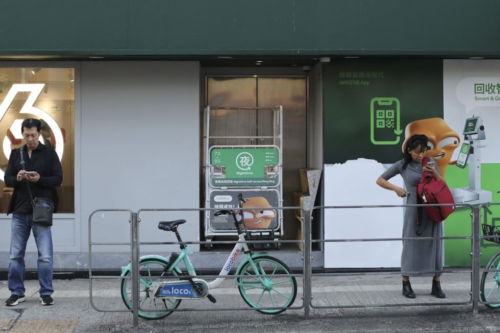 People stand outside a recycling station in Tai Po on January 18. Photo: Xiaomei Chen