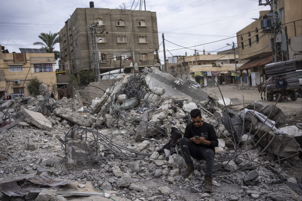 Ibrahim Hasouna, the sole survivor among his family, sits amid the debris of his bombed home in Rafah, southern Gaza Strip. Photo: AP