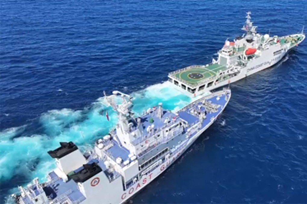 A Chinese coastguard vessel (right) blocking and sailing past Philippine coastguard ship BRP Teresa Magbanua (left) near Scarborough Shoal, in the disputed South China Sea on February 8. Photo: AFP
