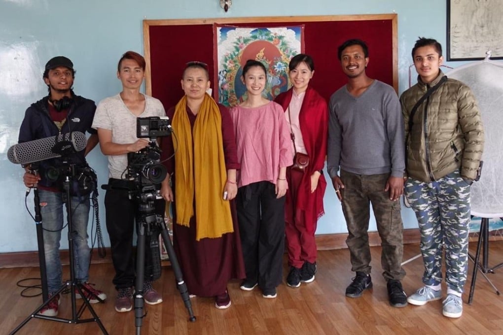 Ani Choying Drolma, wearing a yellow scarf, and Hong Kong filmmaker Jennifer Lin, standing next to Drolma in a pink top, photographed during the shooting of Lin’s documentary about the Nepali Buddhist nun’s escape from poverty and the school she founded to help other girls do the same. Photo: courtesy of Jennifer Lin