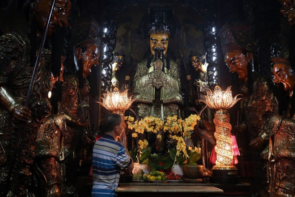 A worshipper prays to the Jade Emperor or Lord of Heaven at a temple in Ho Chi Minh City. Vietnam. People from China’s Fujian province and neighbouring regions, and their descendants in the Chinese diaspora, offer tributes to the deity on the ninth day of Chinese New Year, the Jade Emperor’s birthday. Photo: Getty Images