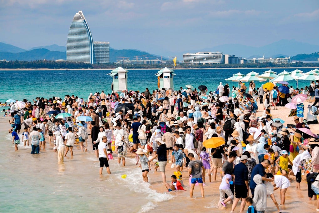 A crowded beach in Hainan earlier this month. Some travellers said they had been caught out by the high numbers travelling to the island, one of China’s main destinations. Photo: Xinhua