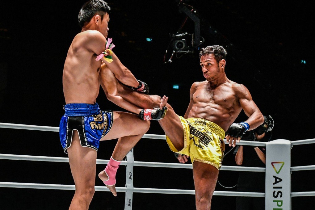 Felipe Lobo (right) kicks Yodpanomrung Jitmuangnon during his split decision win at A New Breed III. Photo: ONE Championship