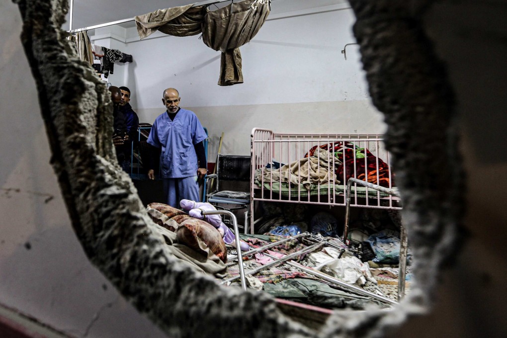 People inspect the damage following Israeli bombardment at Nasser hospital on December 17, 2023. Israeli forces claim they have credible information that the bodies of hostages taken on October 7 may be in the facility. Photo: AFP