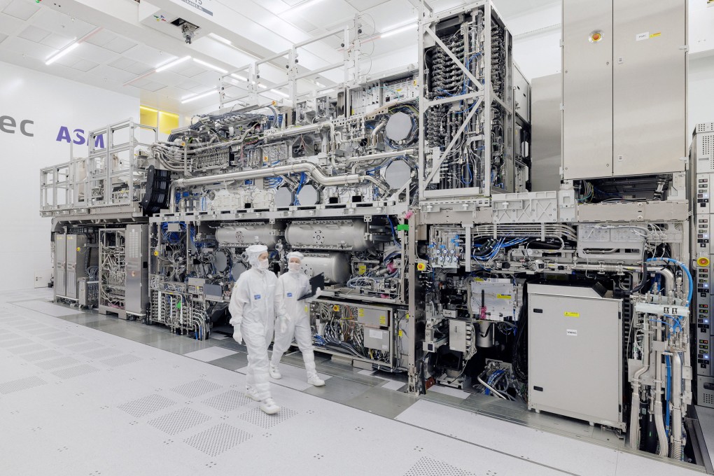 ASML engineers walk past an EUV tool at the company’s headquarters in Veldhoven, Netherlands. Photo: Handout