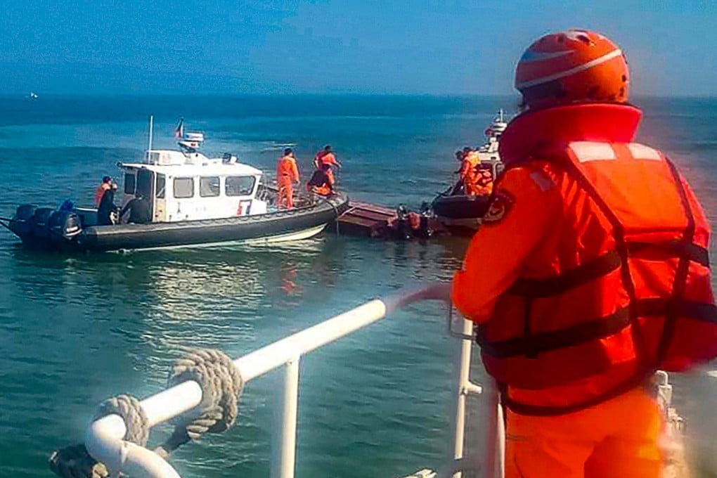 Taiwanese coastguard officers inspect a vessel that capsized during a chase off the coast of Quemoy on Wednesday. Photo: Taiwan Coast Guard Administration via AP