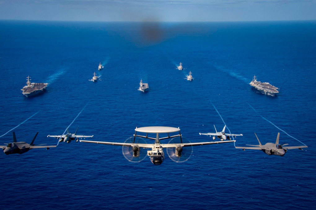 The USS Carl Vinson and USS Theodore Roosevelt aircraft carrier strike groups in formation during the Multi-Large Deck Event in the Philippine Sea in January. Photo: US Navy