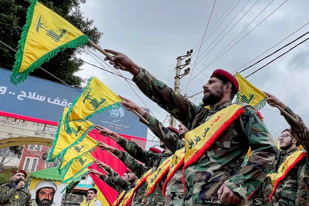 Hezbollah fighters parade during a ceremony to commemorate the party’s fallen leaders in the Lebanese village of Jibshit on Thursday. Photo: AFP