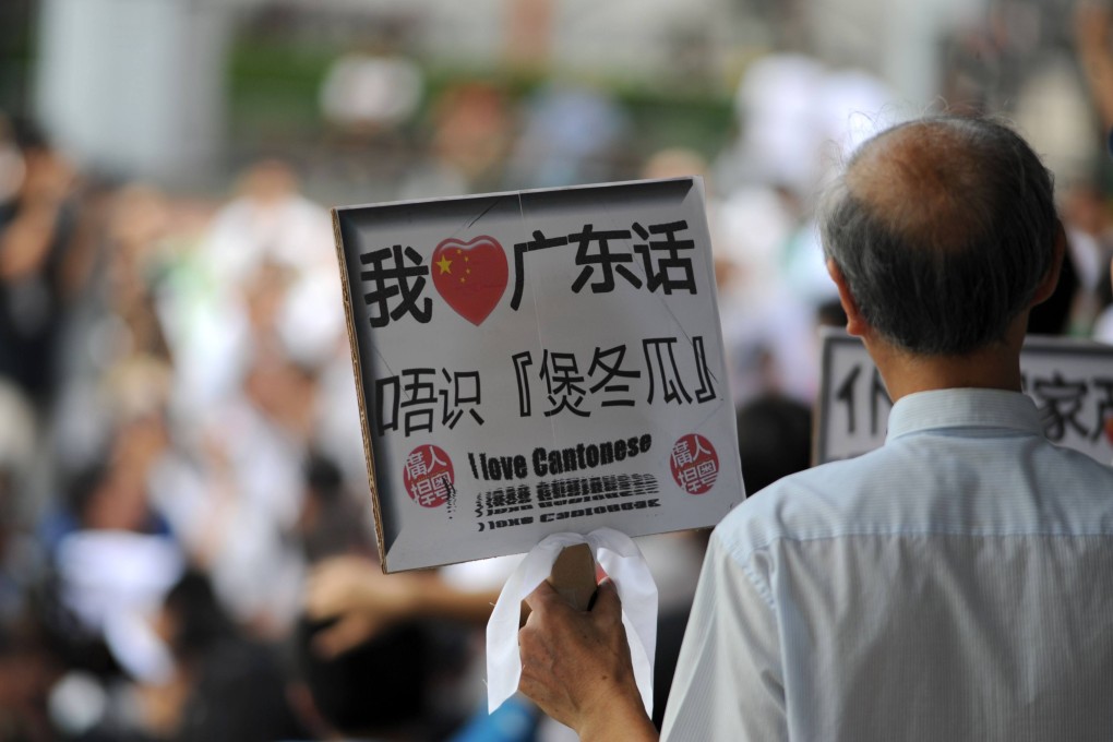 A man holds a sign professing his love for Cantonese at a Hong Kong rally against Mandarin being promoted to the detriment of the dialect widely spoken in the city. Unesco’s International Mother Language Day, celebrated on February 21 each year, recognises the value of linguistic diversity.  Photo: AFP