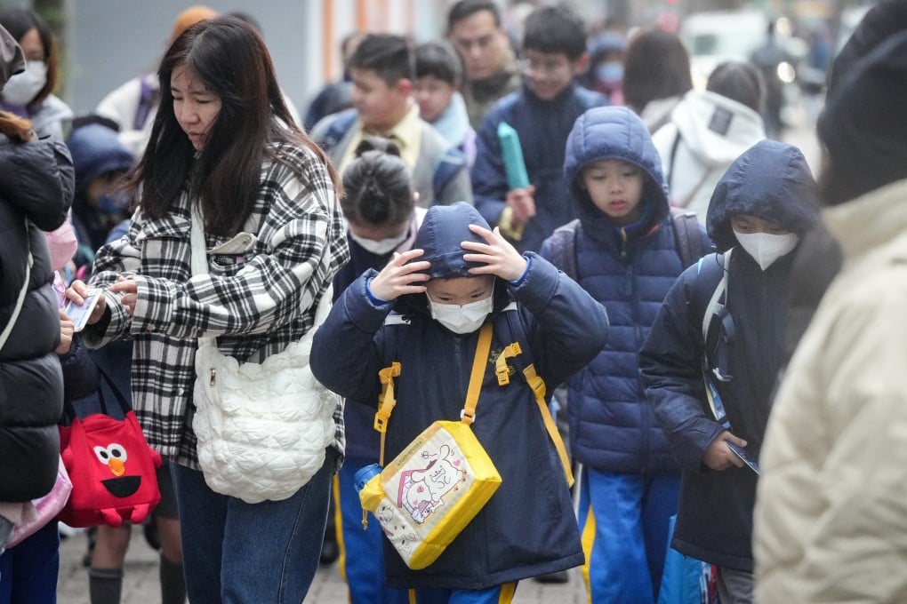 Children walk to school on a chilly morning in Whampoa on January 23. Photo: Eugene Lee