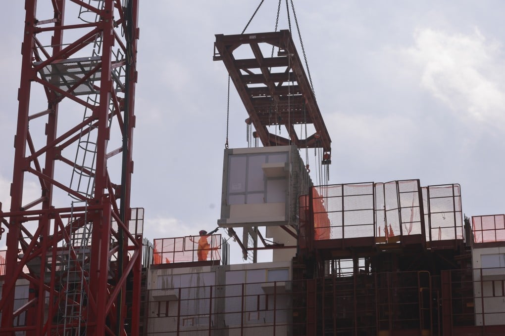 A modular integrated construction unit is added to a public housing project in Hong Kong on December 5, 2023. Photo: May Tse