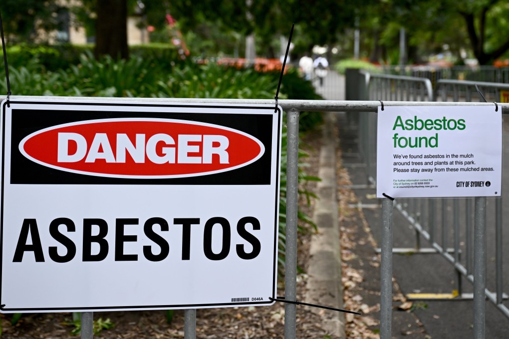 Asbestos signs are displayed at Victoria Park in Sydney. Photo: EPA-EFE