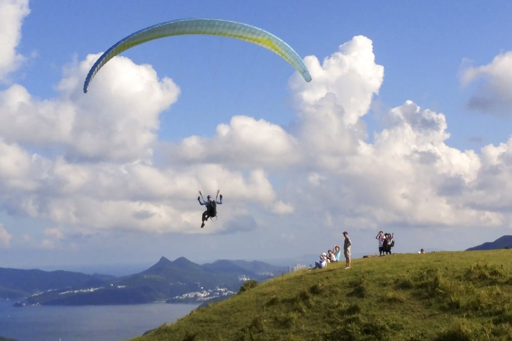 A paraglider in Sai Kung takes to the skies. Police said a 67-year-old man made an emergency landing while paragliding on Friday. Photo: Felix Wong