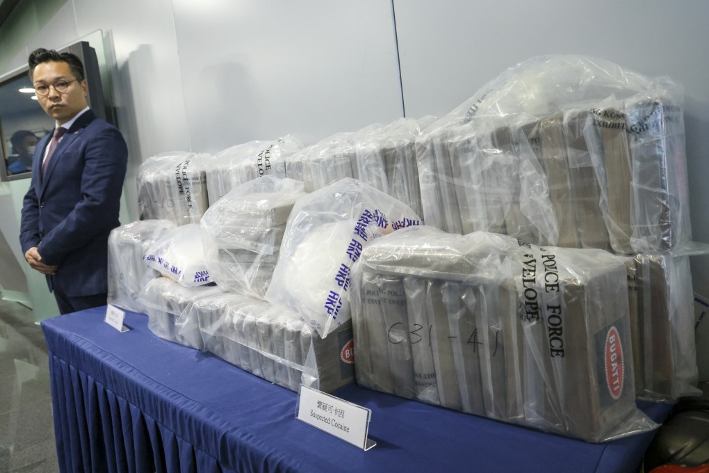 Superintendent Tam Wai-shun of police’s narcotics bureau stands beside the haul of suspected cocaine. Photo: Dickson Lee