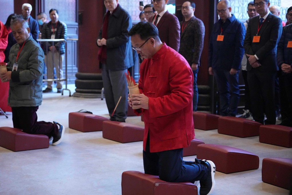 Kenneth Lau Ip-keung, chairman of the Heung Yee Kuk, takes part in fortune-stick-drawing ritual at Che Kung Temple in Sha Tin, on the second day of Lunar New Year, on February 11. Photo: Eugene Lee