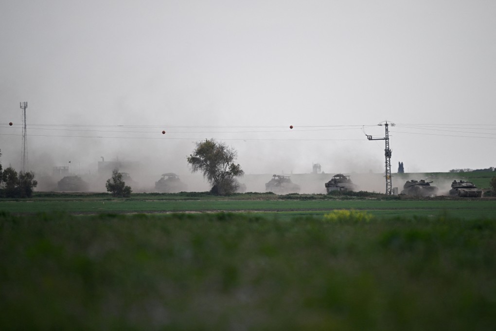 Israeli tanks manoeuvre along the border with Gaza. Photo: Reuters