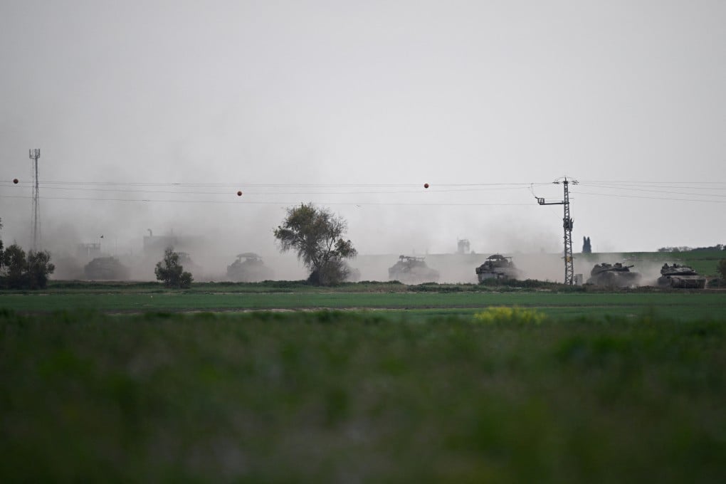 Israeli tanks manoeuvre along the border with Gaza. Photo: Reuters