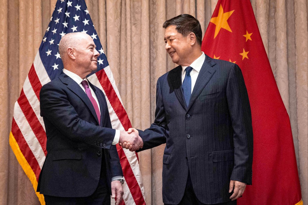 Chinese Public Security Minister Wang Xiaohong and US Homeland Security Secretary Alejandro Mayorkas greet each other in Vienna, Austria, on Sunday. Photo: AFP
