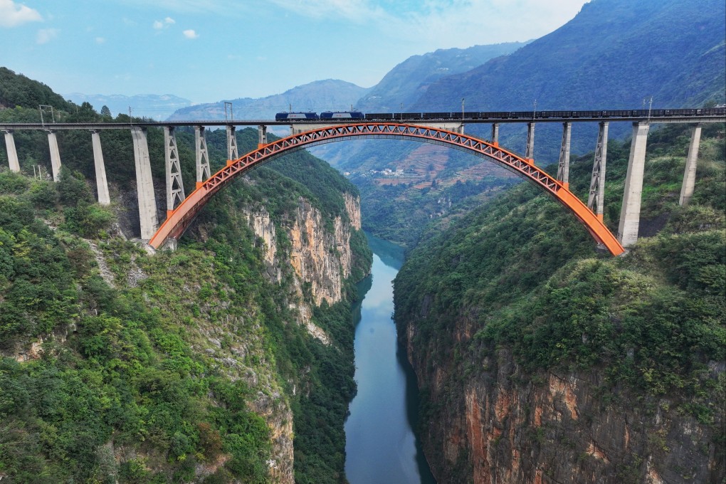 A freight train crosses a bridge near Liupanshui, Guizhou province, China. Photo: Wang Lu