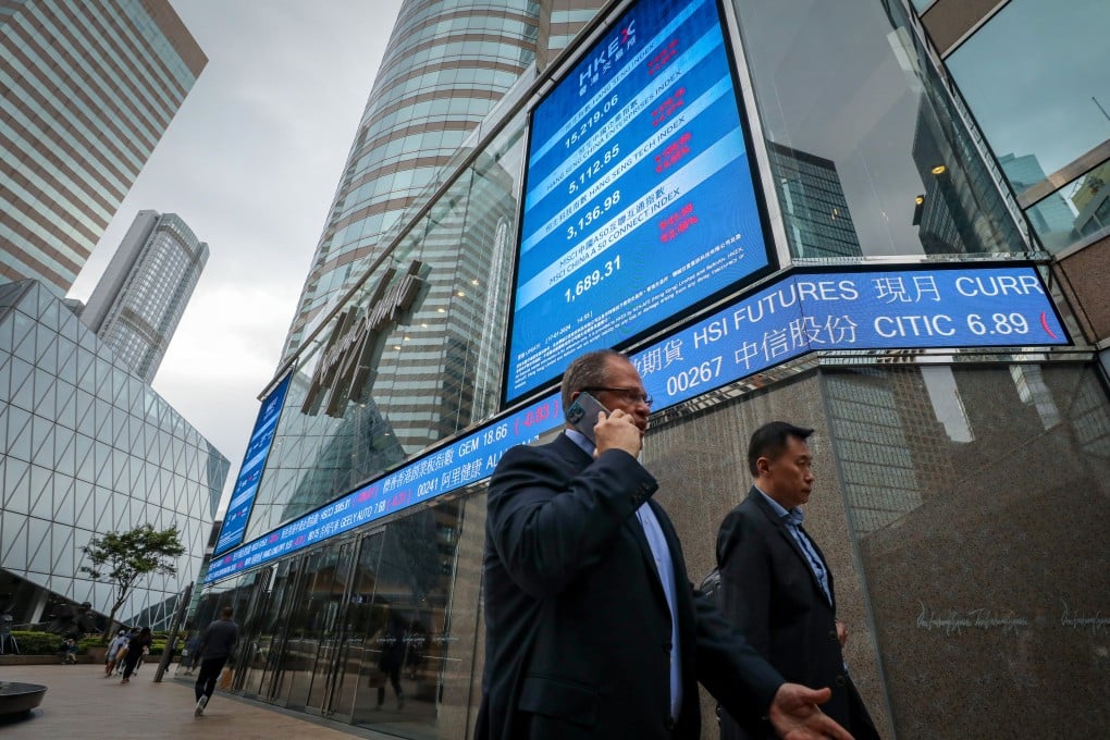 An electronic display shows the Hang Seng Index and stock prices outside the Exchange Square in Central, Hong Kong on January 17. Photo: Sun Yeung