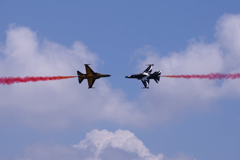 South Korea’s Black Eagles aerobatic team perform at Changi Exhibition Centre during an aerial flying display on Sunday ahead of the Singapore Airshow’s opening. Photo: Reuters