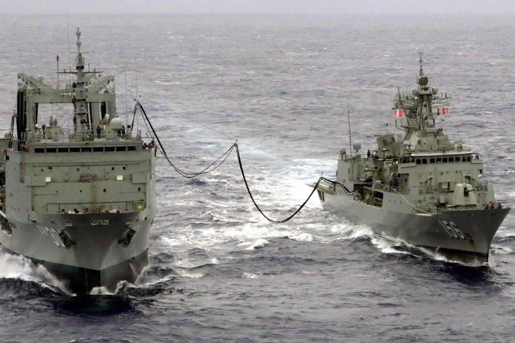 HMAS Toowoomba (right) of the Royal Australian Navy conducts a replenishment-at-sea exercise in 2014. Australia’s current fleet is the oldest the country’s navy has ever operated. Photo: Australian Department of Defence/Handout via EPA