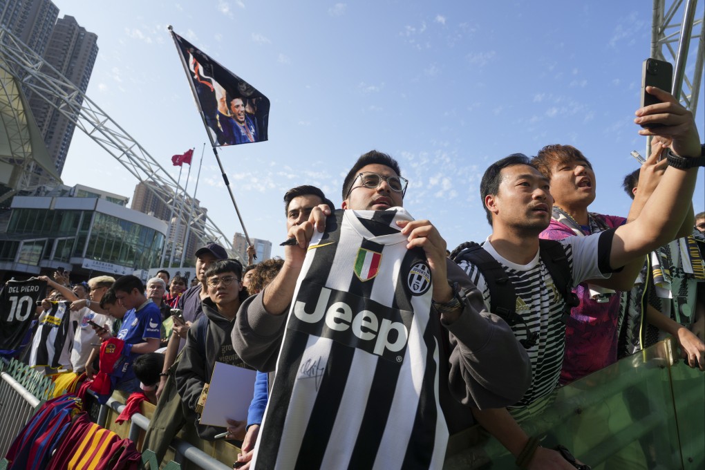 Football fans wait for autographs during the Chinese New Year Cup at Hong Kong Stadium in Causeway Bay on February 13. Tourists have and will come to Hong Kong for sports events. Photo: Sam Tsang