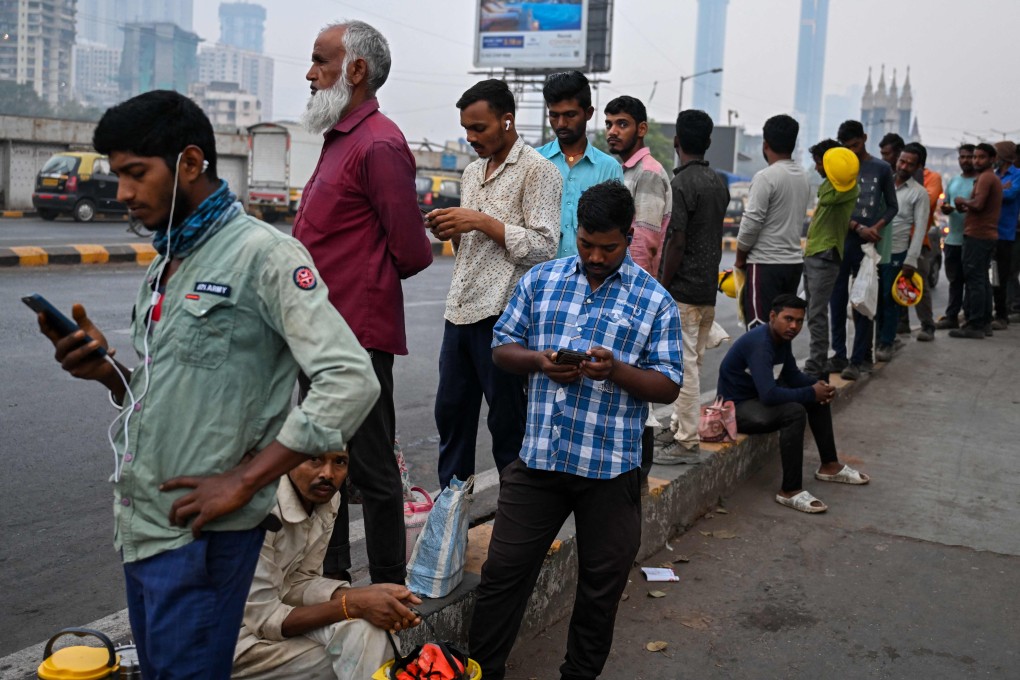 Daily-wage construction workers wait for their transport in Mumbai on February 1. The Philippines, Indonesia, India, Thailand and Vietnam need to prioritise initiatives to create green jobs and digital jobs to cater to the needs of their increasingly educated and demanding young workforces. Photo: AFP