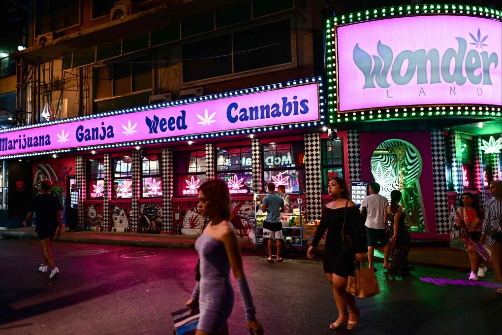 People walk past a cannabis dispensary store in the Sukhumvit area of Bangkok, Thailand. Photo: AFP