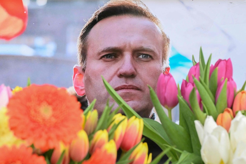 Flowers are placed around a portrait of late Russian opposition leader Alexei Navalny in front of the former Russian consulate in Frankfurt am Main, Germany on Tuesday. Photo: AFP