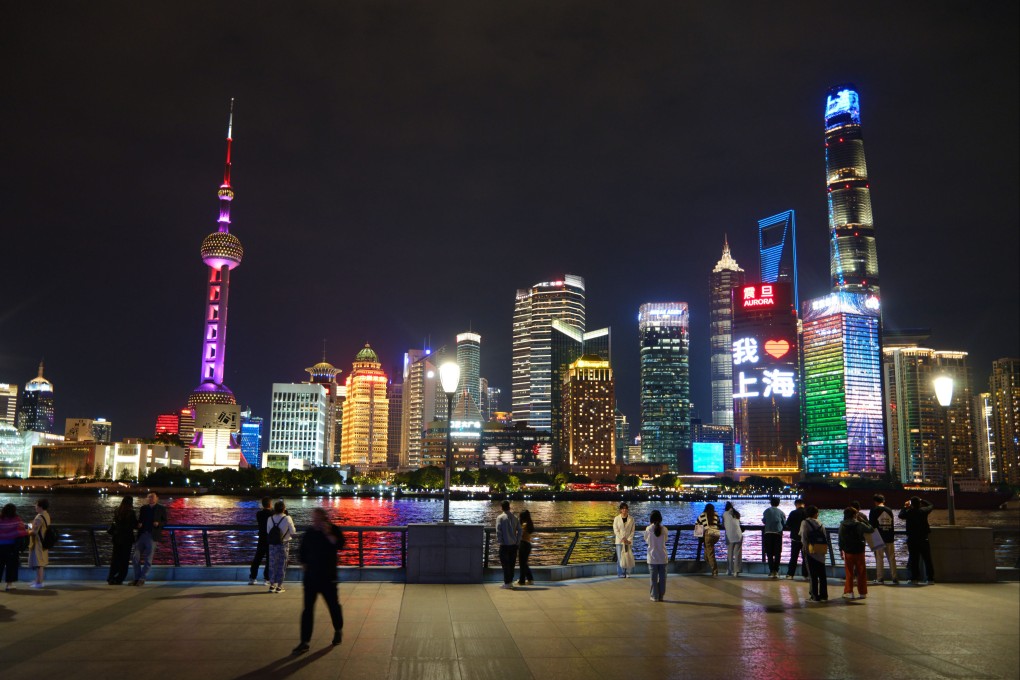 Tourists enjoy the night view of the Bund in Shanghai, China. Photo: VCG via Getty Images