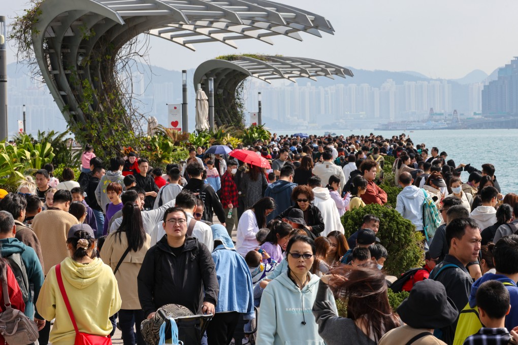 Mainland tourists throng the Avenue of Stars in Tsim Sha Tsui on February 12. The government says visitor numbers over the Lunar New Year recovered to surpass 2018 levels. Photo: Yik Yeung-man