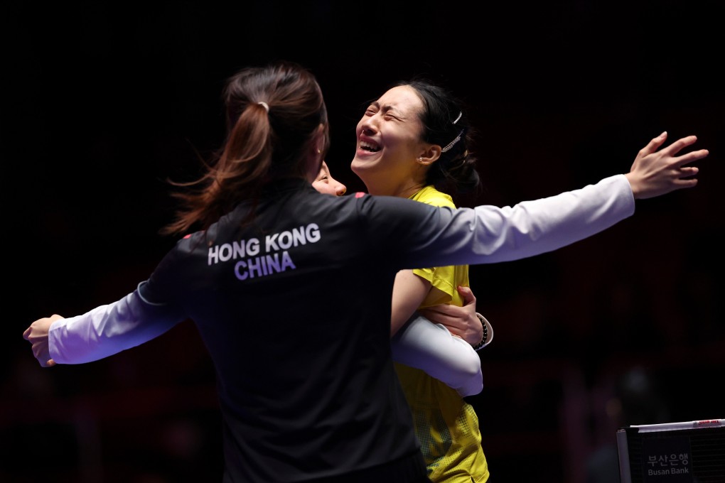 Zhu Chengzhu (right) celebrates with Hong Kong teammates after winning the deciding match against Chinese Taipei in Busan. Photo: Xinhua