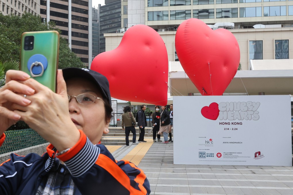 Two three-metre-high heart-shaped balloons are displayed at Central’s Statue Square Gardens in place of the original 12-metre installation. Photo: Edmond So