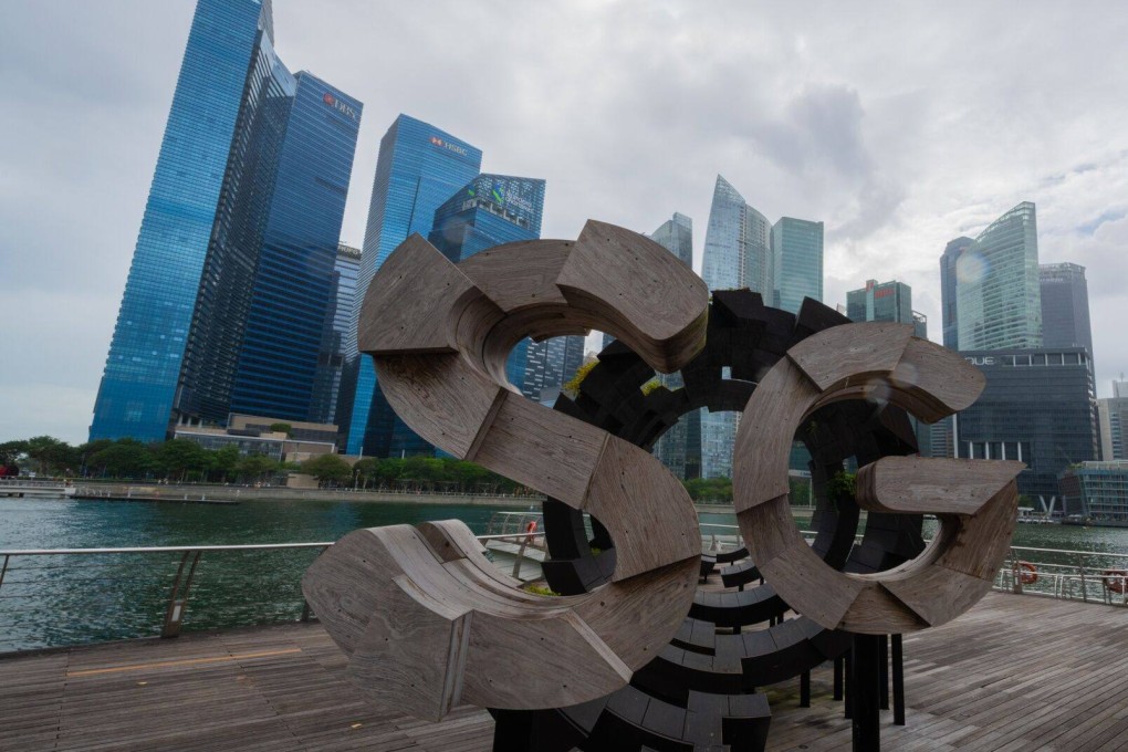 Singapore’s central business district. The city state is investigating a remittance firm for suspected fraudulent trading. Photo: Bloomberg