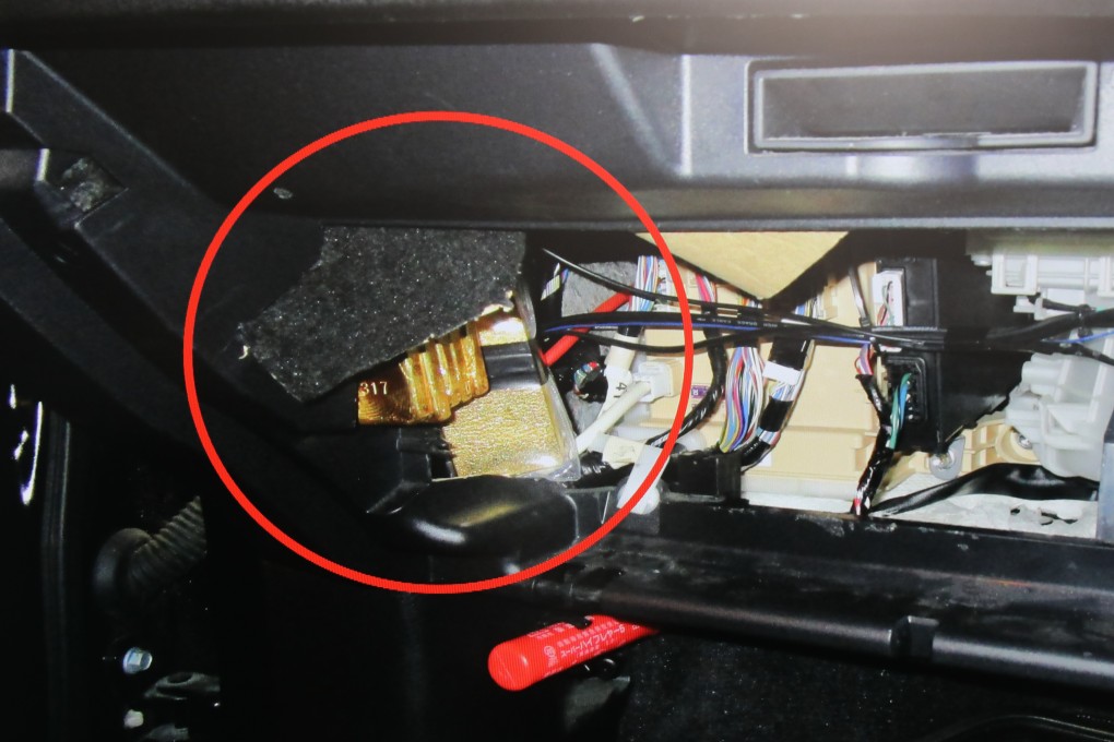 Twenty gold bars (circled) found hidden behind a glove box. Photo: Xiaomei Chen